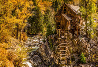 Wooden structure cliff waterfall trees - a waterfall in the background and trees free wallpaper