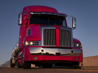Red semi truck road fence - a red semi truck free wallpaper