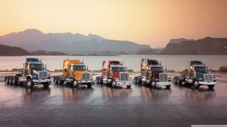 Semi trucks lake mountains parking - a lake free wallpaper for desktop