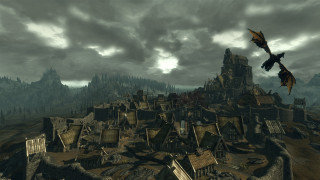 Dragon flying city cloudy mountains - a dark sky free wallpaper