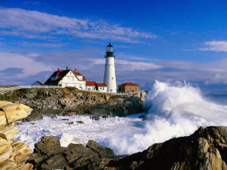 Lighthouse rocky shore crashing wave - a rocky shore free wallpaper