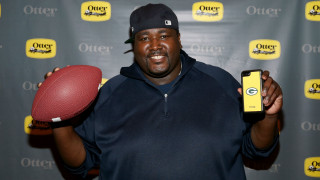 Man holding football cell phone - everett warner free wallpaper