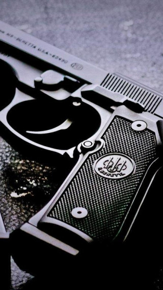 Gun closeup table black white - a close up of a gun free wallpaper