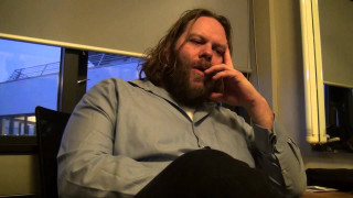 Man sitting chair hand mouth - mitchell mohrhauser free wallpaper