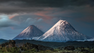 Mountain snowcap cloudy sky green - under a cloudy sky free wallpaper