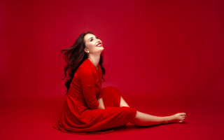 Woman red dress sitting closed - the floor free wallpaper