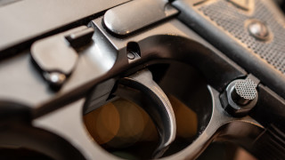 Gun black finish precisionism blurry - a close up of a gun free wallpaper