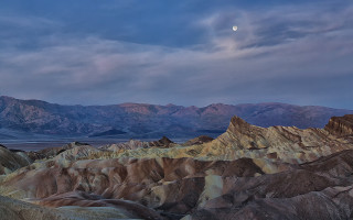 Mountain range moon clouds ocean - a moon in the sky above free wallpaper