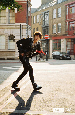 Man black jacket skateboarding city - building free wallpaper