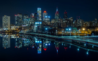 City skyline night bridge river 15 - a bridge and a river in front free wallpaper