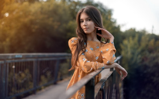 Woman leaning rail phone trees - a rail free wallpaper