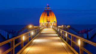 Wooden walkway yellow structure night - perfect symmetry free wallpaper