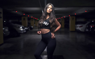 Woman black top leggings parking 2 - emma ríos free wallpaper