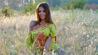 Woman green dress smiling field - figurative art free wallpaper