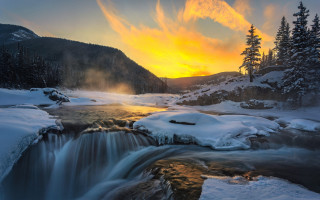 Snowy forest stream sunset clouds - a stream of water free wallpaper