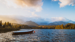 Mountain lake boat nature sky - cloudy free wallpaper