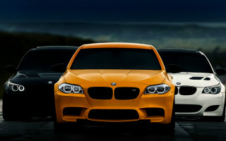 Three colored cars night parking - a dark sky in the background free wallpaper