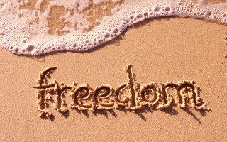 Sand wave beachchair sunset silhouette - a beach chair free wallpaper
