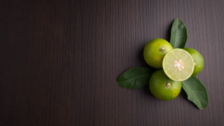 Limes leaves stilllife foodphotography minimalist - a brown background free wallpaper