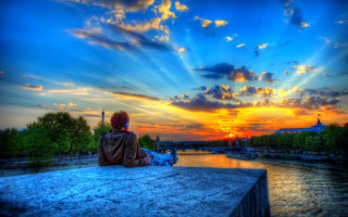Person sunset river boat building - a sunset over a river free wallpaper