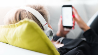 Woman couch headphones yellow jacket - headphone free wallpaper