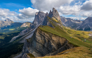 Mountain range grassy field cloudy 3 - a grassy field below free wallpaper