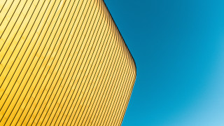 Yellow building blue sky plane - a yellow building free wallpaper