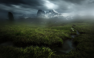 Grassy field stream cloudy mountains - a stream free wallpaper