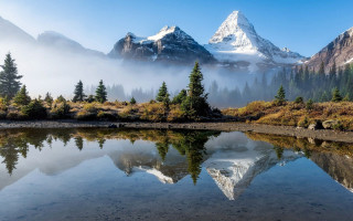 Mountain lake trees snowpeak castle - peak in the background free wallpaper