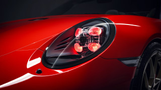Red sports car headlight black - a close up free wallpaper