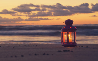 Lantern beach sunset waves mountain - the water behind free wallpaper