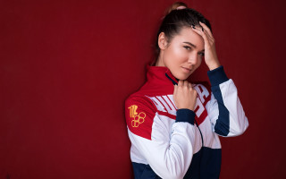 Woman redwhite jacket holding head - figurativism free wallpaper