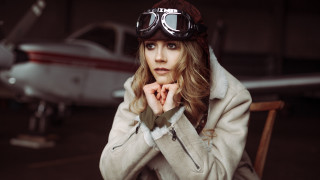 Woman goggles jacket plane hangar - dieselpunk free wallpaper