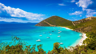 Beach boats mountain clouds sky - the water and a mountain in the background free wallpaper