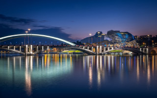 Bridge river lit building night - a bridge over a river free wallpaper