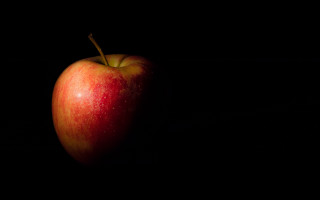 Red apple black table shadow - a red apple free wallpaper