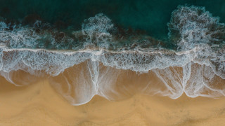 Beach waves crashing ocean surf - a blue ocean in the background free wallpaper