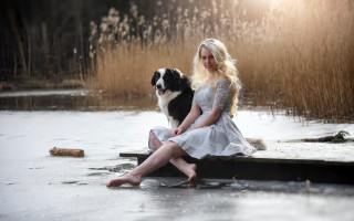 Woman dock dog lap portrait - a pond free wallpaper