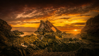 Rocky beach sunset formation water - david paton free wallpaper