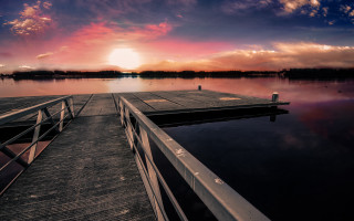 Sunset dock clouds water cityscape 2 - a sunset in the background free wallpaper