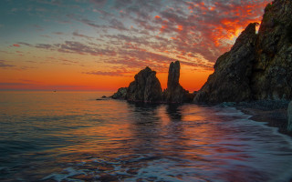 Sunset ocean rocks boat mystical - the water and a boat free wallpaper