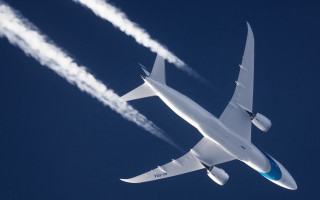Large jetliner blue sky smoke 2 - sky free wallpaper