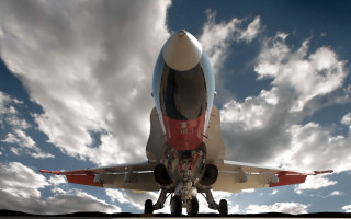 Jet plane clouds red tail - a red tail free wallpaper