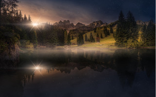 Lake mountains trees night cloudy - tree and mountains under a cloudy sky free wallpaper
