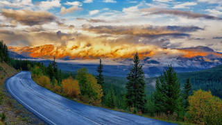 Mountain road clouds trees sunset - a road free wallpaper for desktop