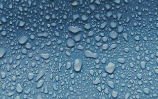 Water droplets blue surface black - a white border free wallpaper