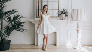 Woman white dress fireplace plant - a fireplace free wallpaper
