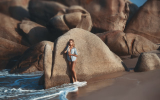 Woman surfboard beach rocks waves - a surfboard free wallpaper