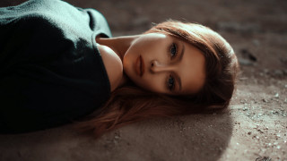 Woman laying on ground closed - her chest free wallpaper