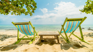 Beach chairs table ocean sky - free bikini wallpaper